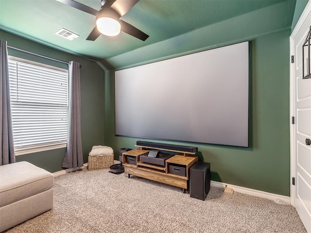 carpeted cinema featuring lofted ceiling and ceiling fan