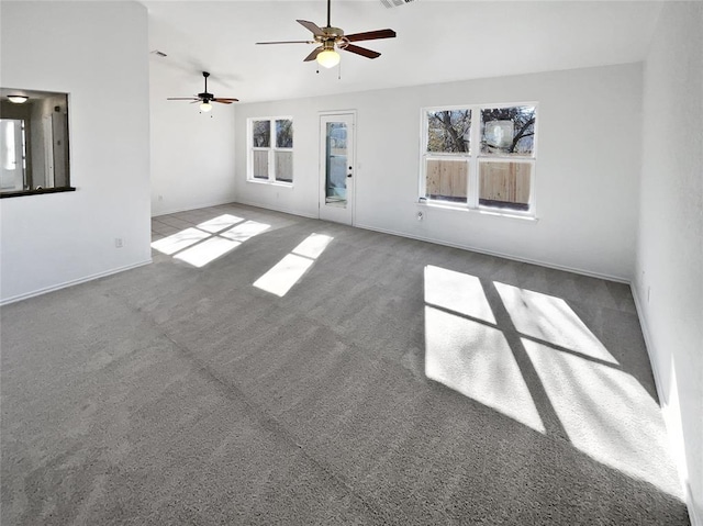 interior space featuring carpet floors and ceiling fan