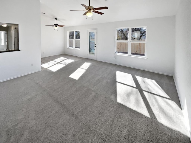 interior space with ceiling fan and carpet floors