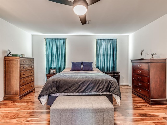 bedroom featuring ceiling fan and light hardwood / wood-style floors