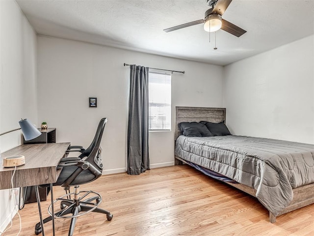 bedroom featuring light hardwood / wood-style flooring and ceiling fan