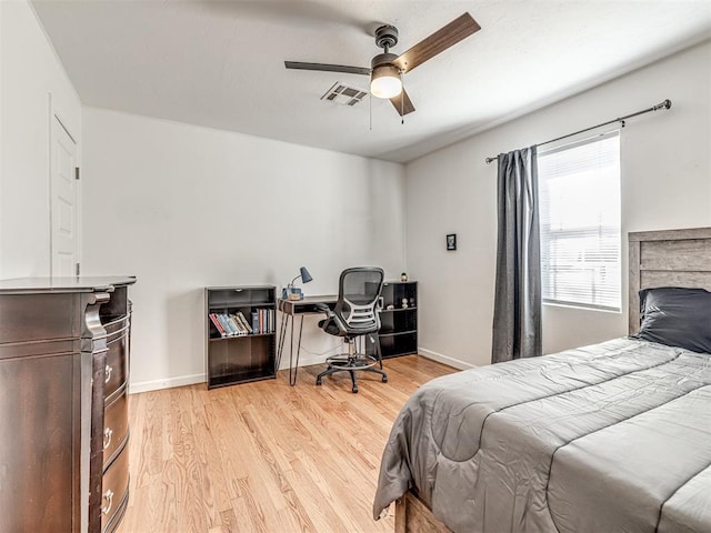 bedroom with ceiling fan and light wood-type flooring