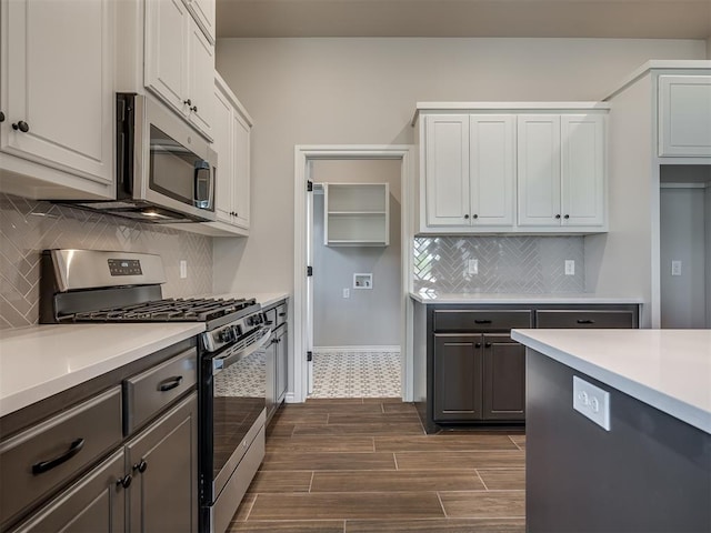 kitchen with white cabinetry and appliances with stainless steel finishes