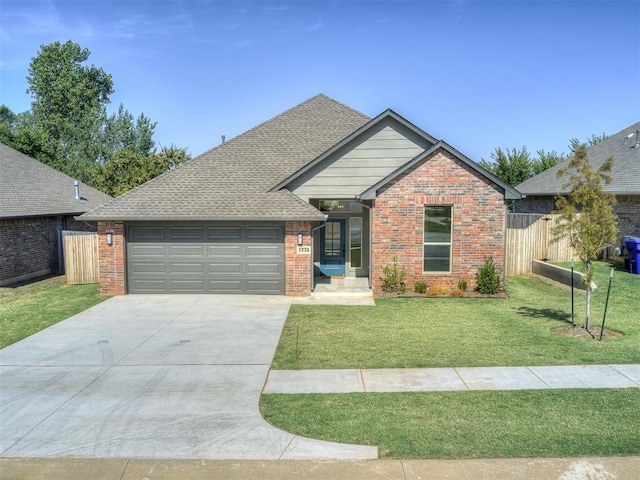 view of front of house featuring a garage and a front yard