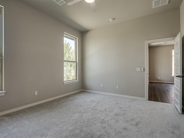 carpeted empty room with ceiling fan