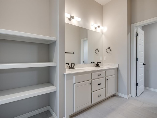 bathroom with tile patterned flooring and vanity