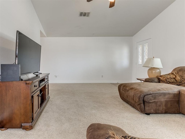 carpeted living room with lofted ceiling and ceiling fan