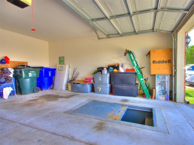 garage featuring a garage door opener