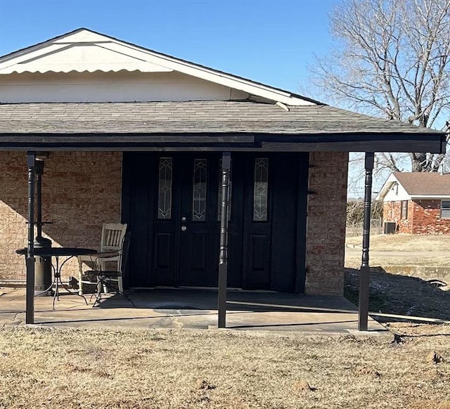 rear view of property featuring a patio area