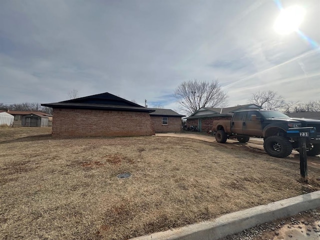 view of property exterior featuring a lawn