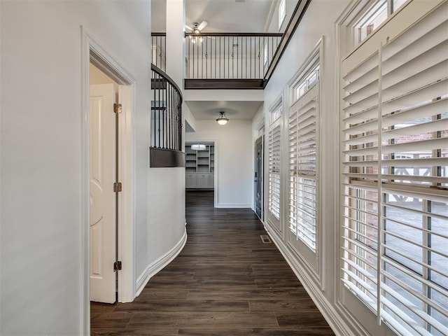 hallway with dark hardwood / wood-style floors