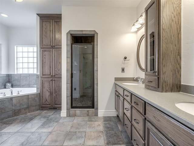 bathroom featuring independent shower and bath and vanity