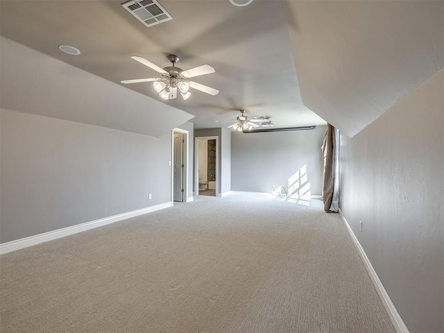 bonus room with ceiling fan, lofted ceiling, and carpet floors