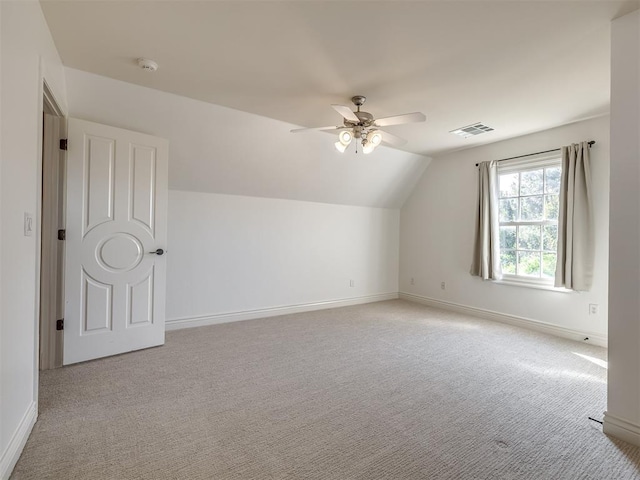 bonus room featuring lofted ceiling, light carpet, and ceiling fan