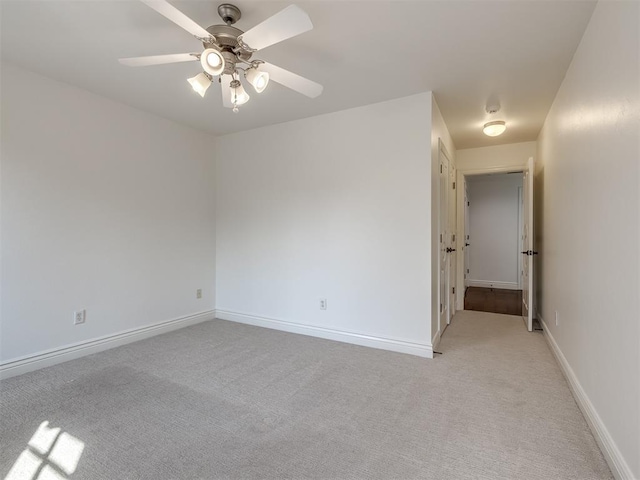 carpeted empty room with ceiling fan