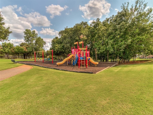 view of playground with a lawn