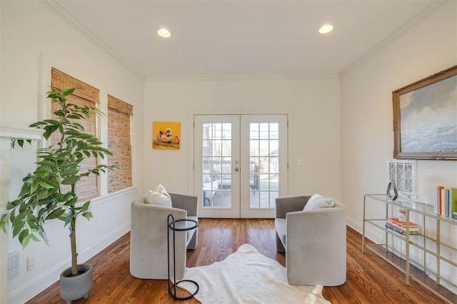 sitting room featuring ornamental molding, dark hardwood / wood-style flooring, and french doors