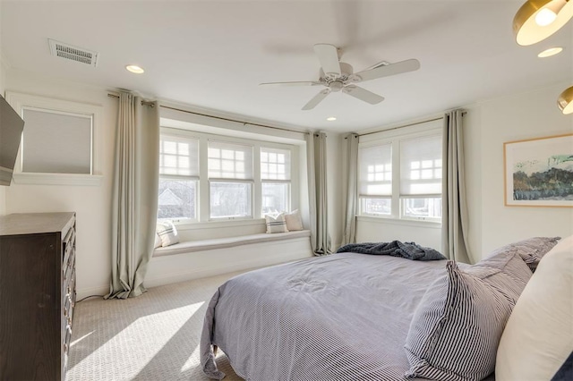 bedroom with light carpet and ceiling fan