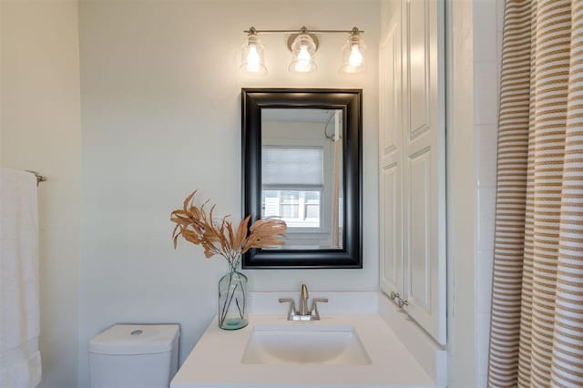 bathroom with toilet and sink