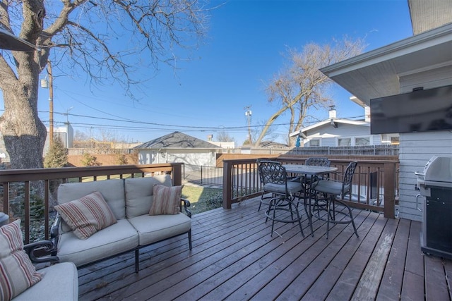 deck featuring a grill and an outdoor hangout area