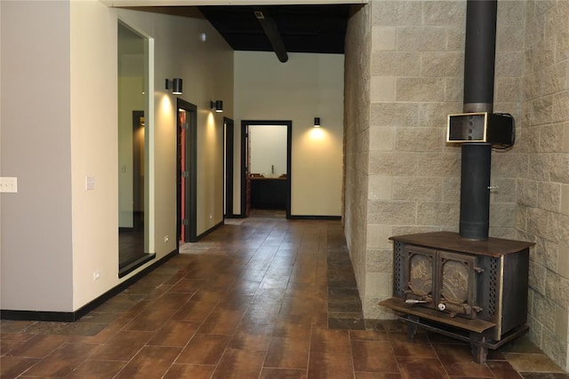 corridor with baseboards and dark wood-style flooring