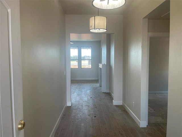 corridor featuring dark hardwood / wood-style floors