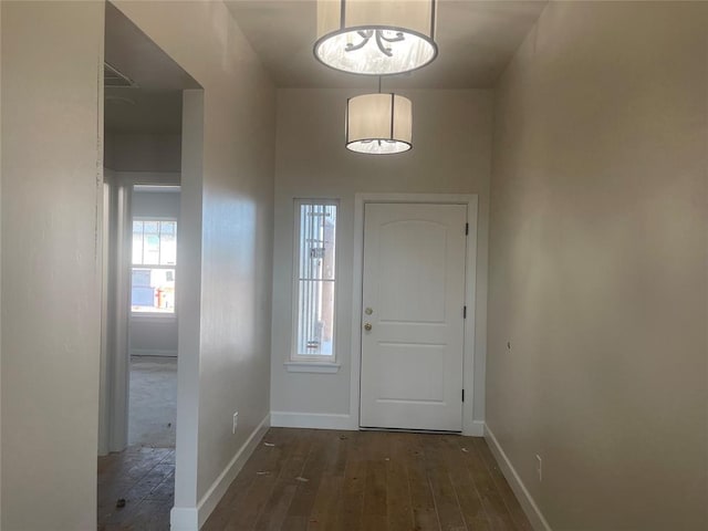 foyer entrance with dark hardwood / wood-style flooring