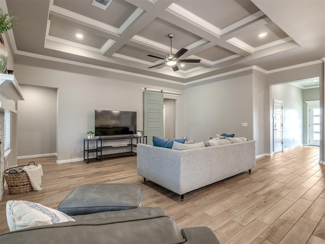 living room with a barn door, coffered ceiling, ceiling fan, and light hardwood / wood-style flooring