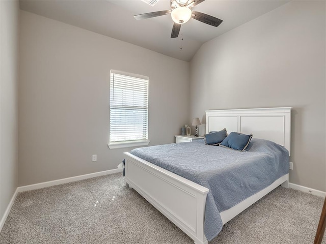 carpeted bedroom featuring lofted ceiling and ceiling fan