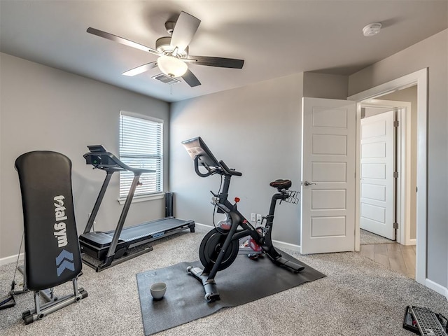 exercise area with light colored carpet and ceiling fan