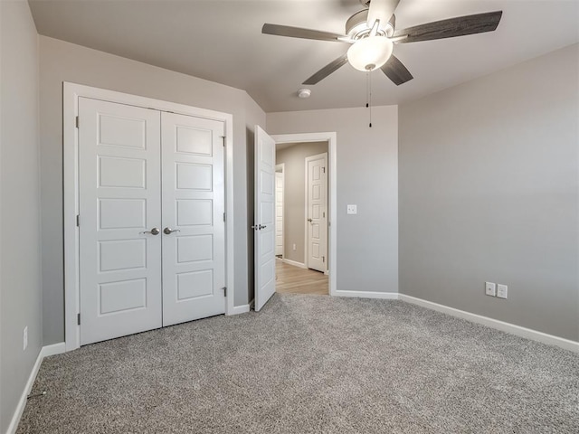 unfurnished bedroom featuring light carpet, ceiling fan, and a closet