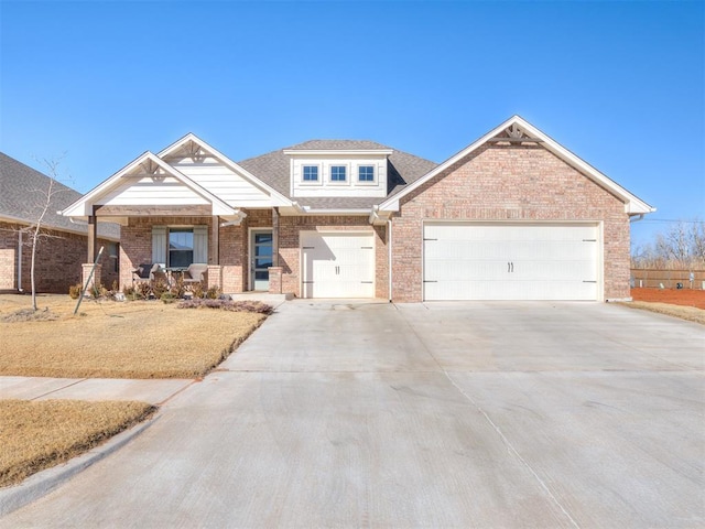 view of front of home with a garage and covered porch