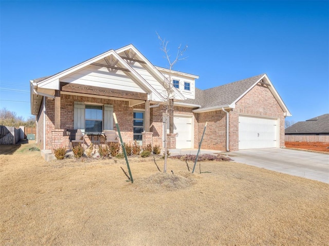 craftsman-style home with a porch, a garage, and a front lawn