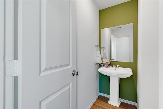 bathroom featuring sink and wood-type flooring