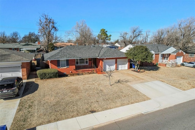 ranch-style house with a garage and covered porch