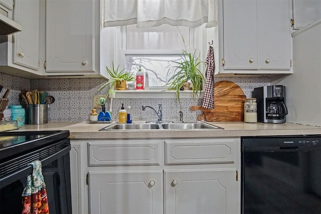 kitchen featuring sink, white cabinets, decorative backsplash, custom exhaust hood, and black appliances