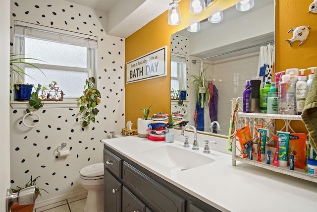 bathroom featuring tile patterned flooring, vanity, a shower with curtain, and toilet