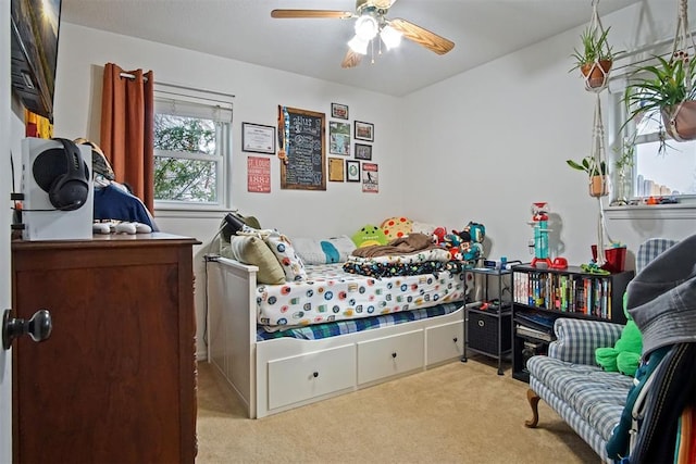 carpeted bedroom with ceiling fan