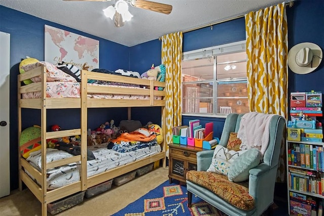 bedroom with a textured ceiling, ceiling fan, and carpet