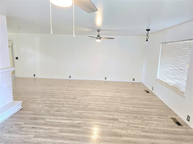 unfurnished room with ceiling fan and light hardwood / wood-style flooring