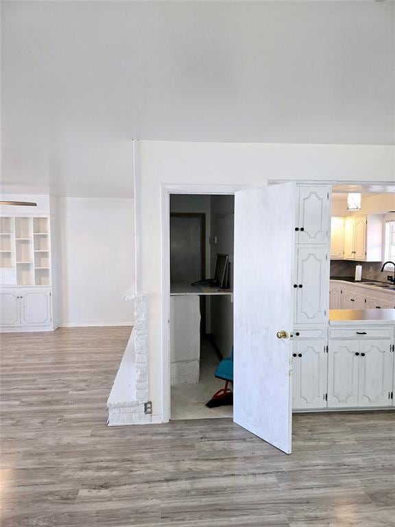 interior space with sink and light wood-type flooring