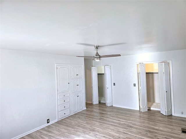 unfurnished bedroom featuring ceiling fan and light hardwood / wood-style floors