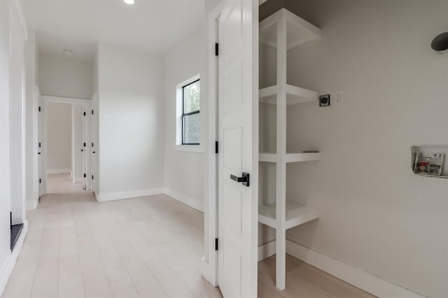 hall with light hardwood / wood-style floors