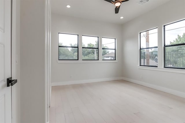 unfurnished room featuring light hardwood / wood-style flooring and ceiling fan