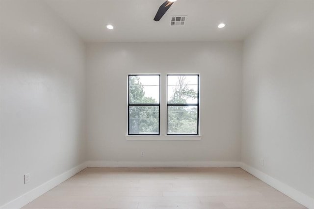 spare room with ceiling fan and light hardwood / wood-style flooring