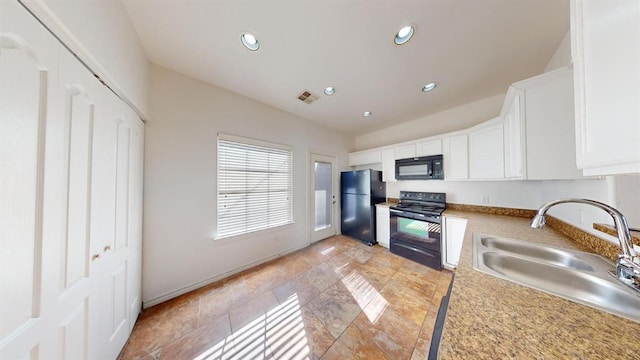 kitchen with white cabinets, sink, and black appliances