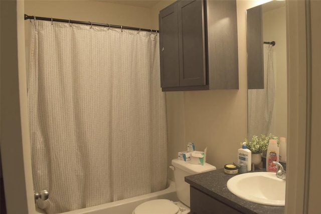 full bathroom featuring vanity, shower / bath combo with shower curtain, and toilet