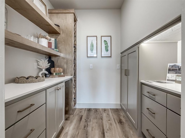 interior space with gray cabinetry and light hardwood / wood-style floors