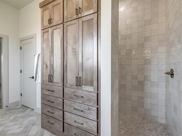 bathroom featuring a shower with shower door