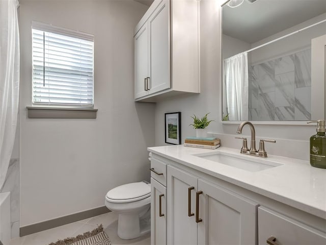 bathroom featuring vanity, curtained shower, tile patterned floors, and toilet